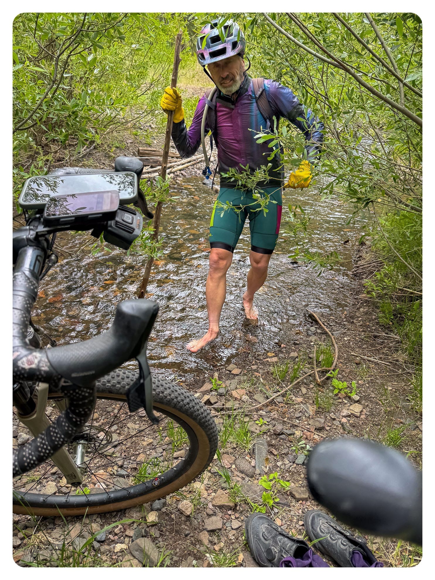 Author wading across a cold creek