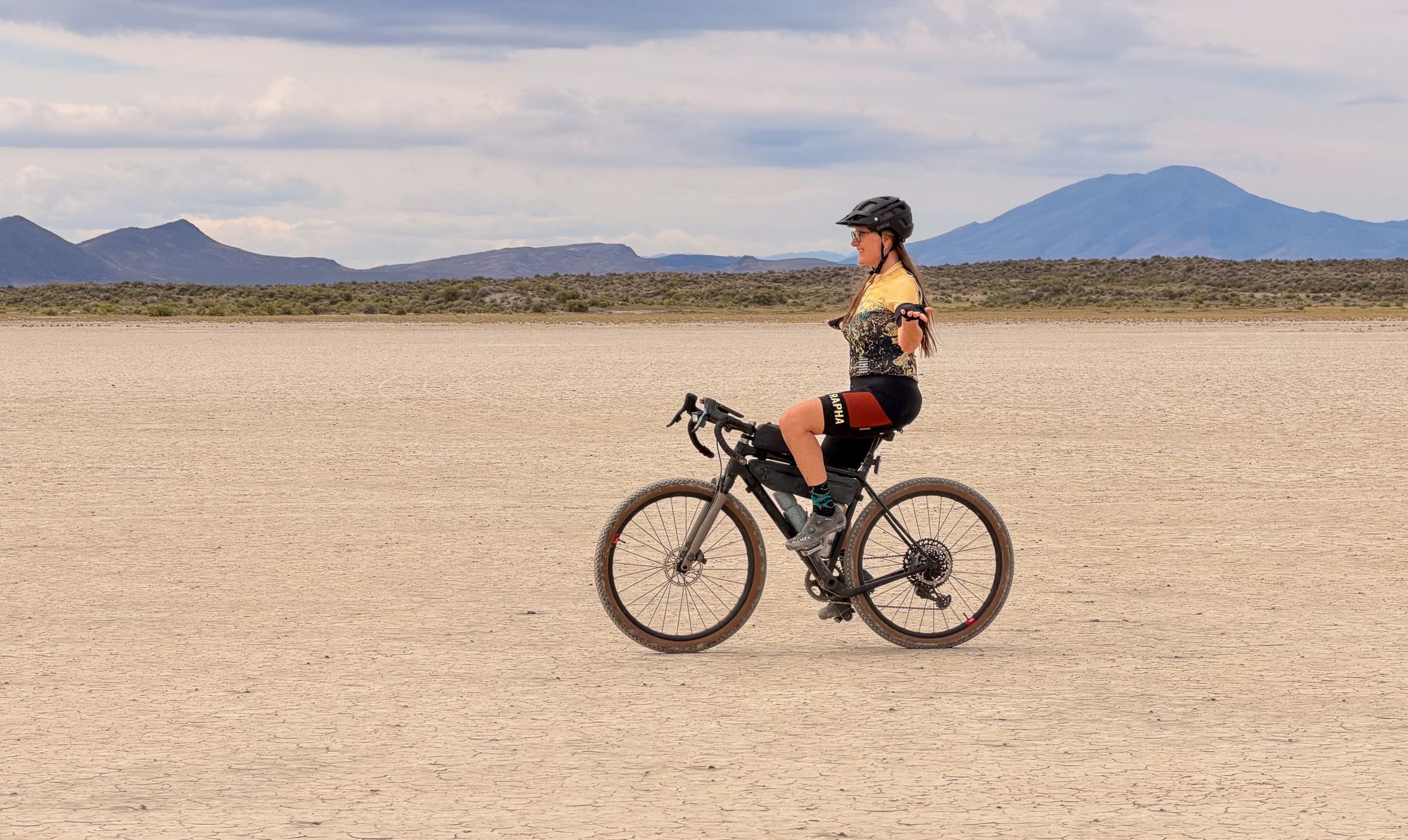 Riding the Alvord Playa, Steens Mountain behind
