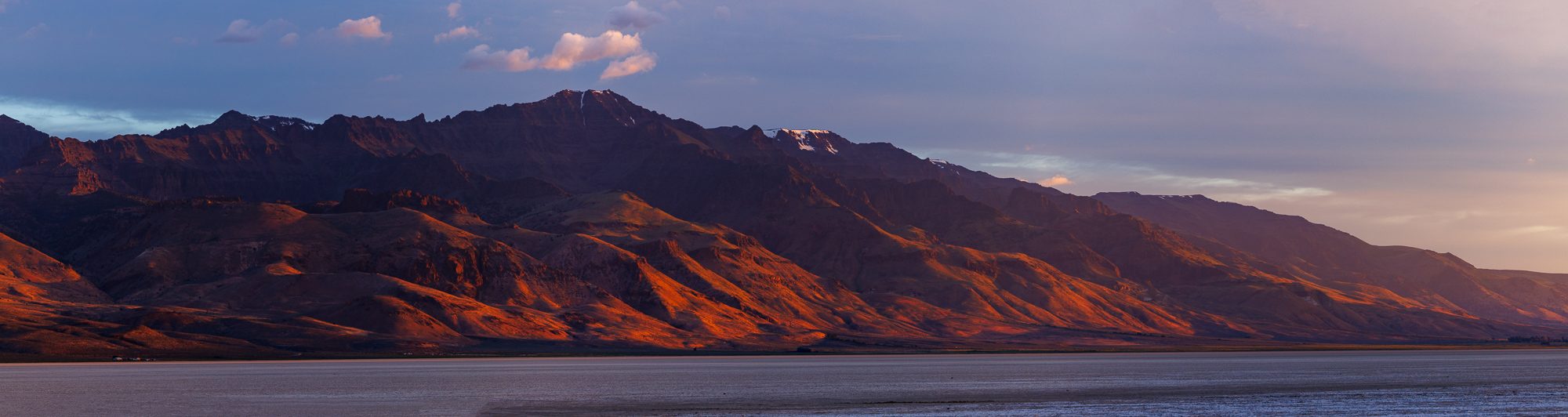 Steens Mountain in orange and purple sunrise light